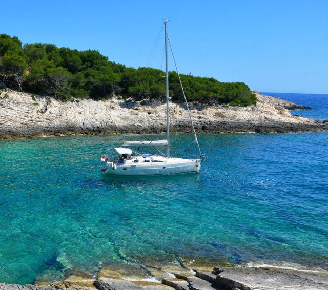Swim or snorkel in a secluded cove on island Vis